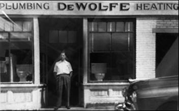 Vintage photo of the historic storefront for DeWolfe Plumbing & Heating in central Massachusetts